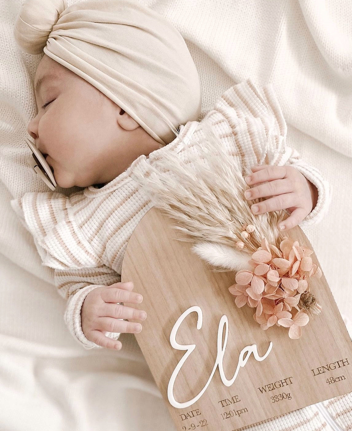 Dried floral plaque with birth details